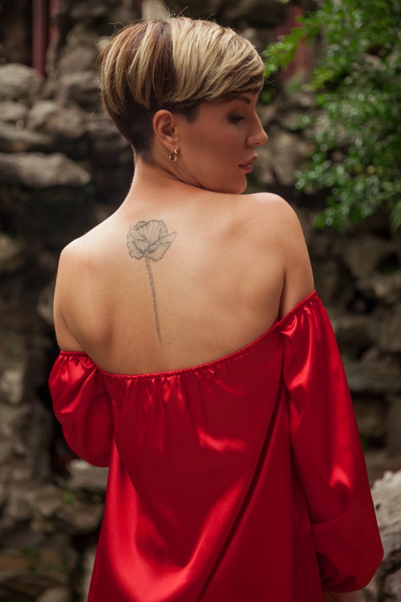 Beautiful young woman in red dress in Yuyuan Garden, Shanghai, China