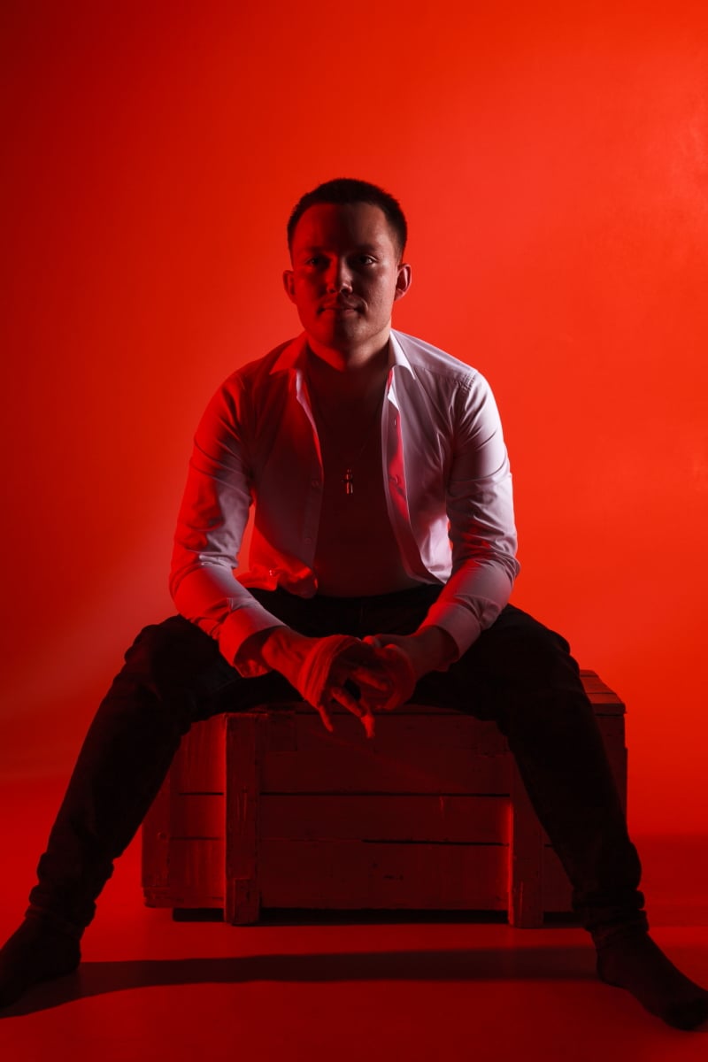 Man creative portrait on red background RedRD25