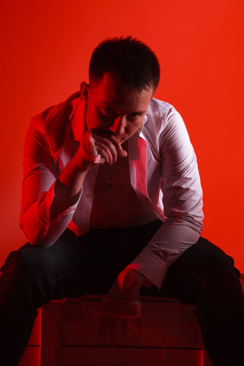 Man creative portrait on red background RedRD28