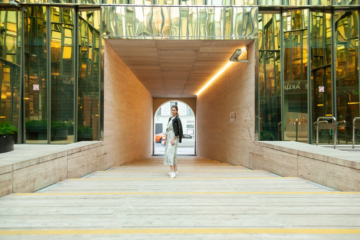 Girl portrait in a city glass corner